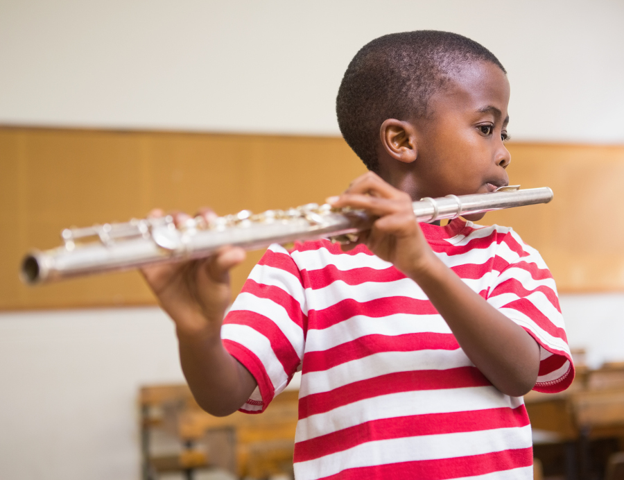 Boy plays flute